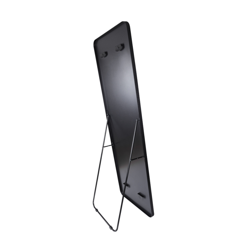 Rear view of black full-length mirror showing MDF backing, wall-mount hooks, and slim black metal easel stand
