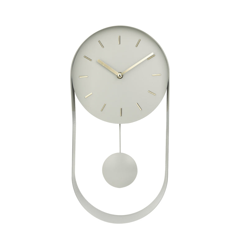Pale green iron pendulum wall clock with gold-tone hands and hour markers, oval open frame base, front view on white backg…