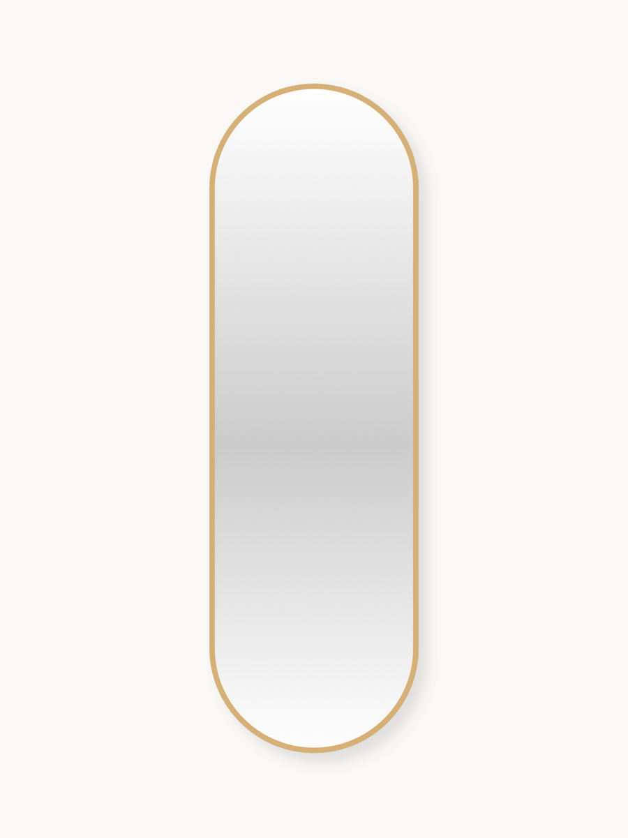Tall capsule-shaped wall mirror with a thin gold aluminium frame against a light background, front view