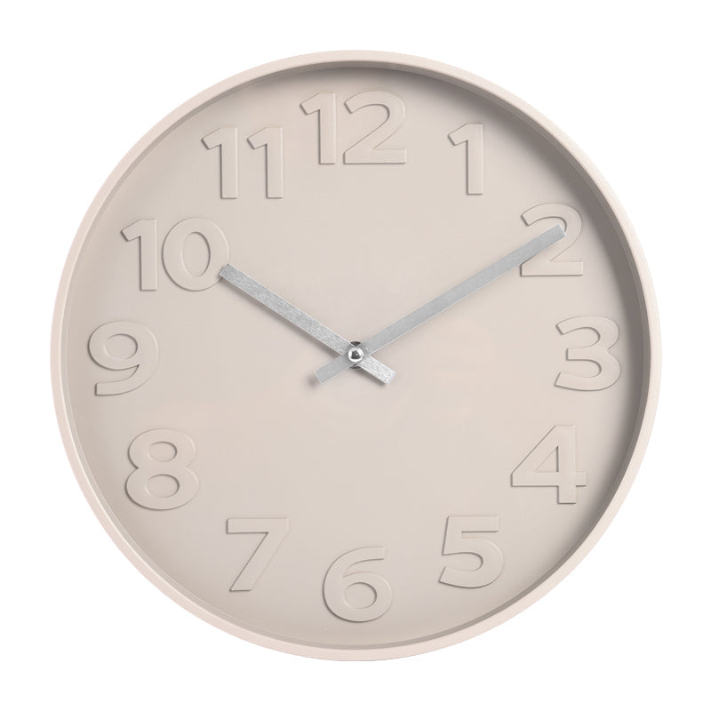 Beige round wall clock with embossed numerals and silver hands, front view on white background