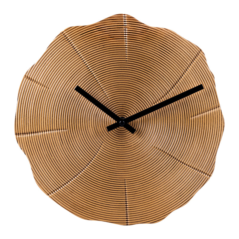 Bronze resin wall clock with organic irregular edge, concentric tree-ring texture, and black hands, front view on white ba…