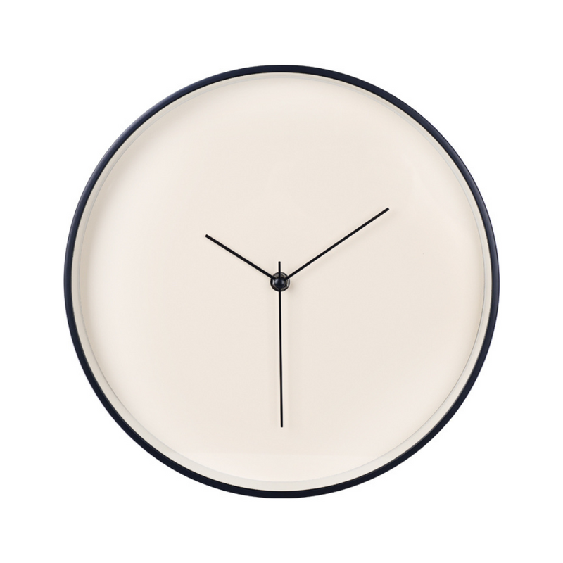 Round wall clock with cream-white dial, navy blue plastic frame, and slim black hands, front view on white background