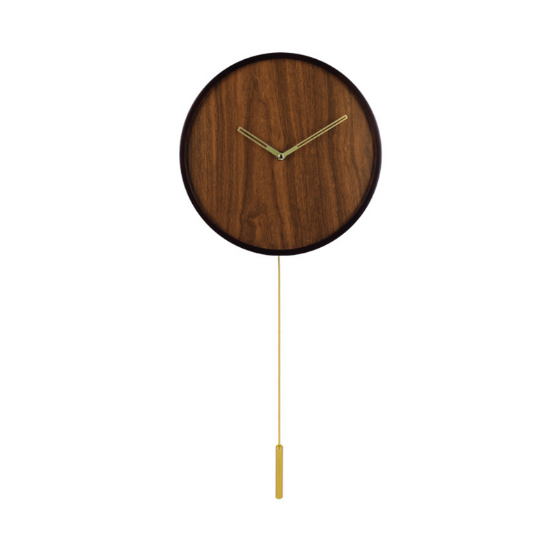 Round walnut-finish wall clock with minimalist brass-tone hands and slim hanging pendulum rod, front view on white background