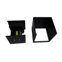 Black cube LED wall lamp disassembled: base unit with yellow COB LED chip and screw terminals beside empty square housing…