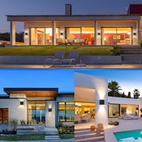 Three dusk exterior lifestyle shots showing black cube LED wall lamps mounted on modern home facades, casting warm up-down…