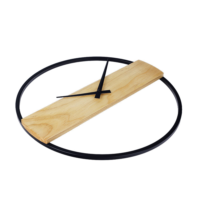 Reykjavik wall clock viewed from low angle, black circular iron frame with natural wood panel and black hands, no numerals