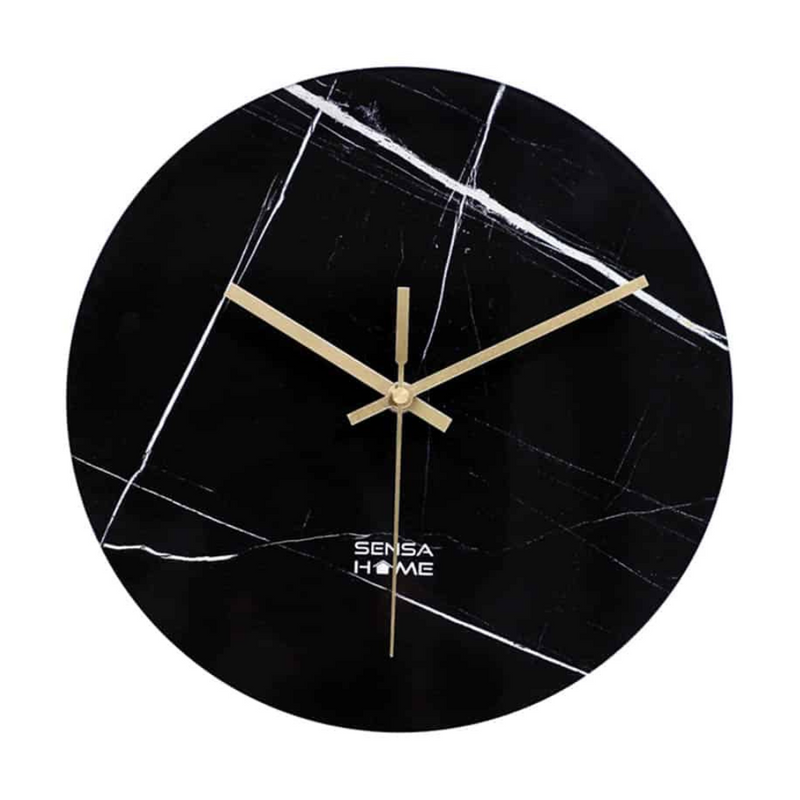 Round black marble-print glass wall clock with gold hands, no numerals, white veining across face, front view on white bac…