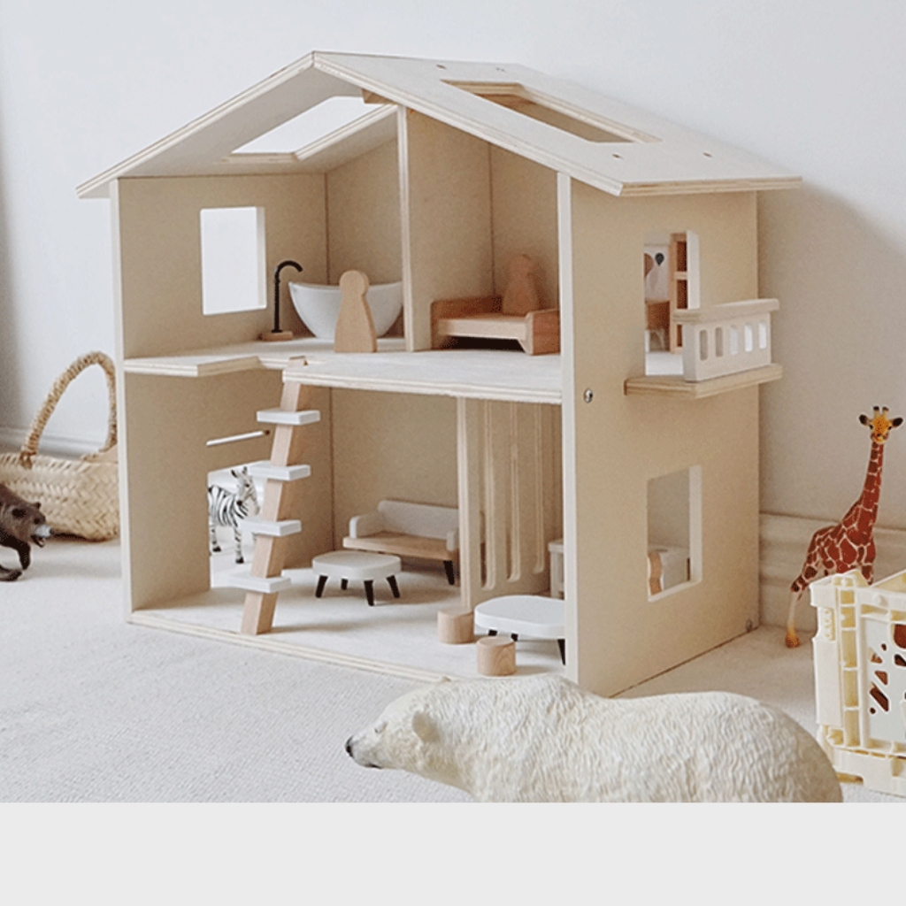 Casa de muñecas de madera con muebles.