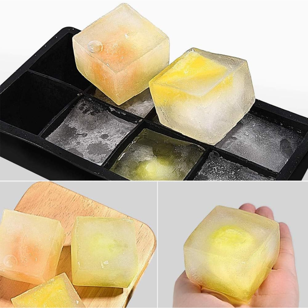 Three-panel collage showing large yellow-tinted ice cubes released from a black silicone tray, displayed on a wooden board…