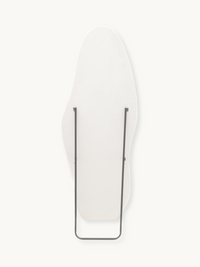 Back view of Seraphina standing mirror showing white teddy fabric panel and slim dark metal easel support brackets