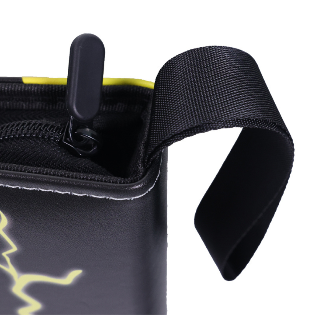 Close-up of black card binder top corner showing zipper puller, neon yellow lining, and wide black nylon carry handle