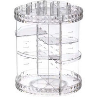 Clear acrylic rotating makeup organiser, empty, showing diamond-cut base and top rim, three adjustable interior shelves, f…