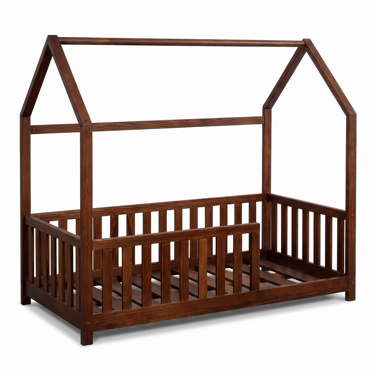 Walnut brown wooden house bed with triangular roof frame, vertical safety rails on three sides, and slatted base, angled f…