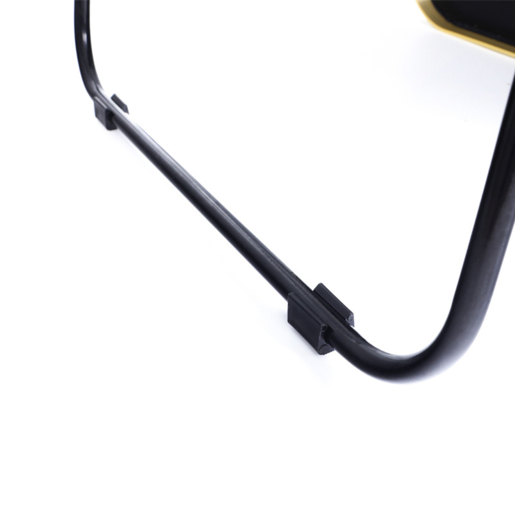 Black aluminium mirror frame corner detail showing curved bottom edge and two small black bracket clips, close-up view
