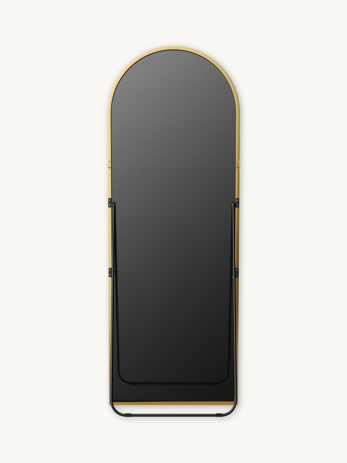 Front view of full-length arched mirror showing black metal easel stand and base rail against white background, gold frame…