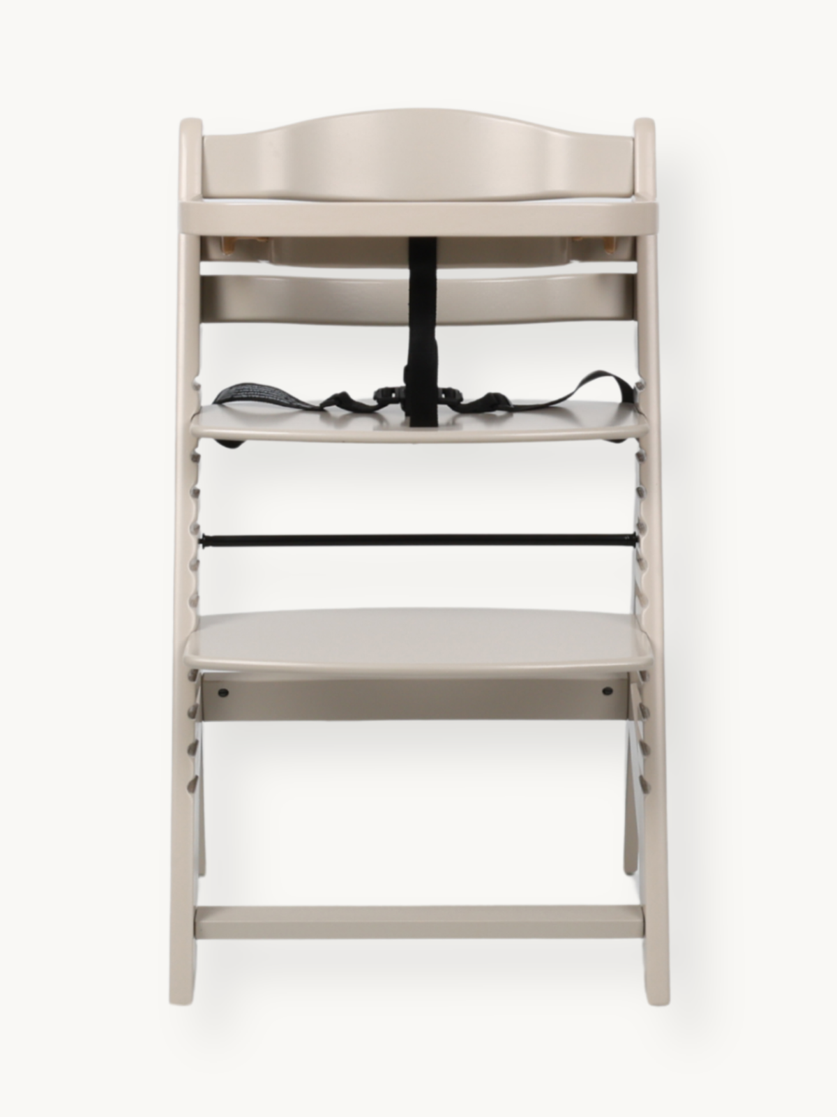 Clay beige wooden highchair front view, black 5-point harness on seat, adjustable footrest below, no tray attached