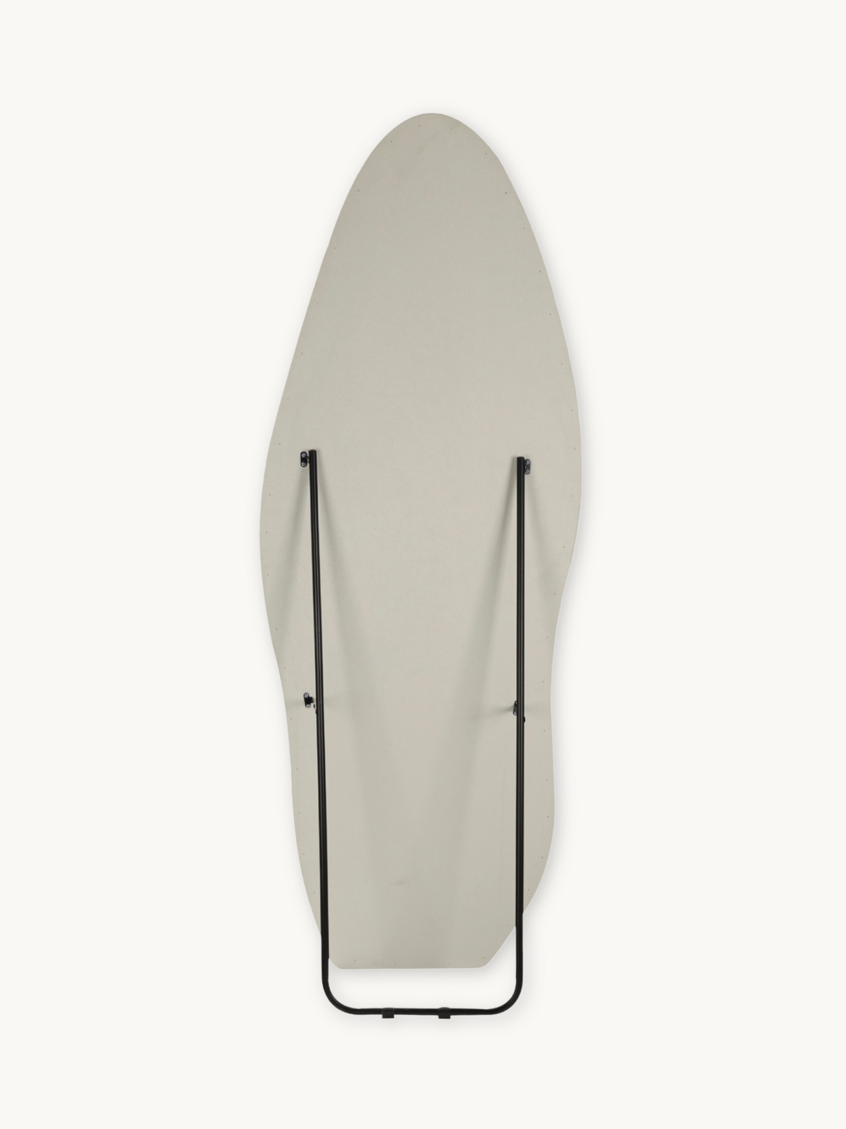 Rear flat-on view of tall asymmetric white mirror showing black metal support rod and folded easel stand against plain bac…