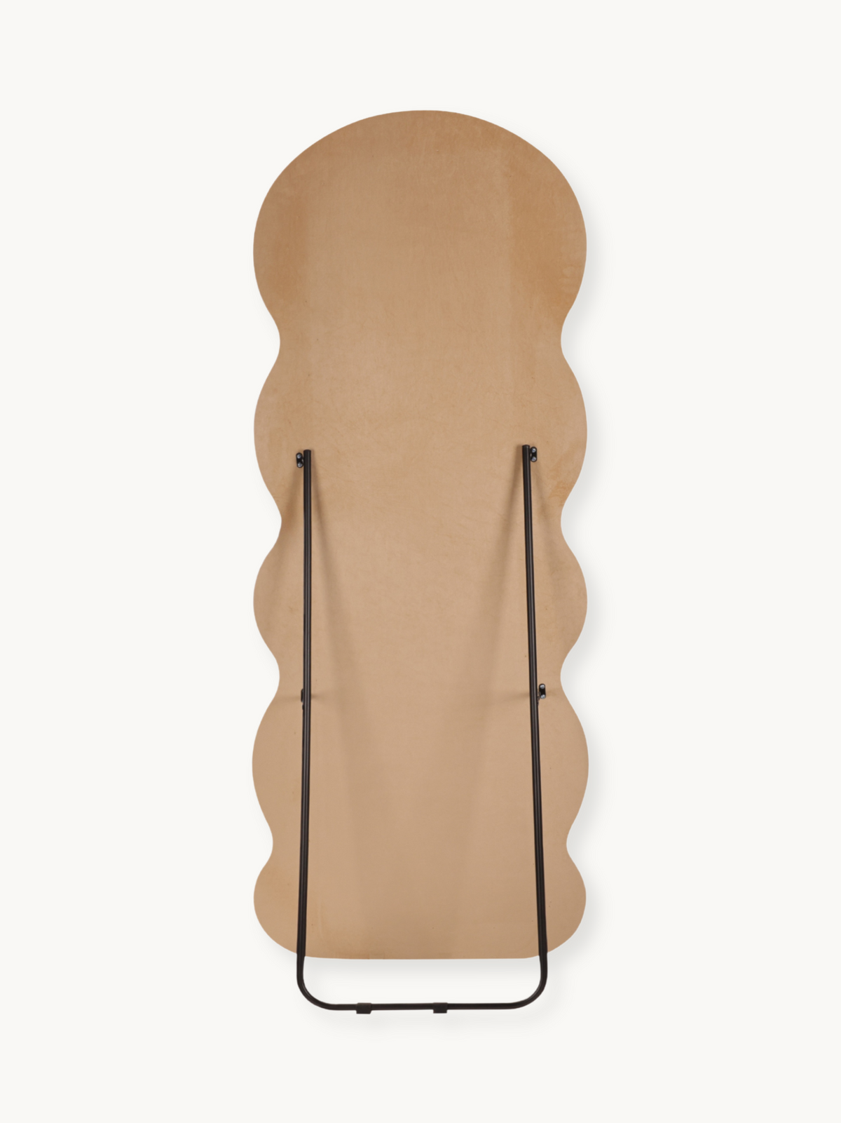 Rear view of wavy full-length mirror flat on surface, taupe beige suede velvet back and black metal folding easel stand vi…