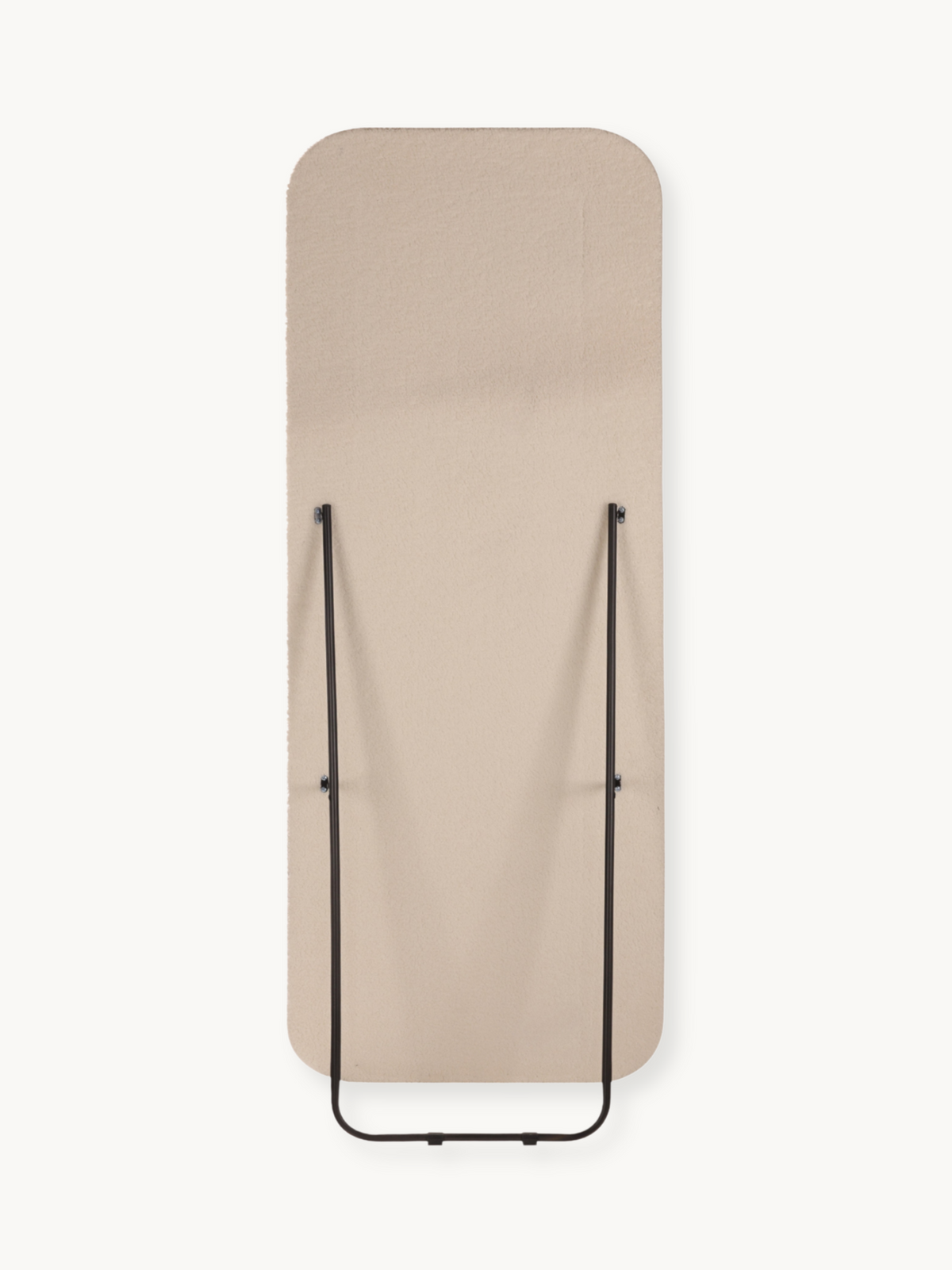 Rear view of Felis standing mirror flat, showing beige teddy fabric back and folded black metal support frame, white backg…