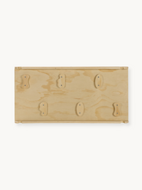 Underside of natural wood climbing panel showing six screw-fixed wooden holds in two rows, flat product view