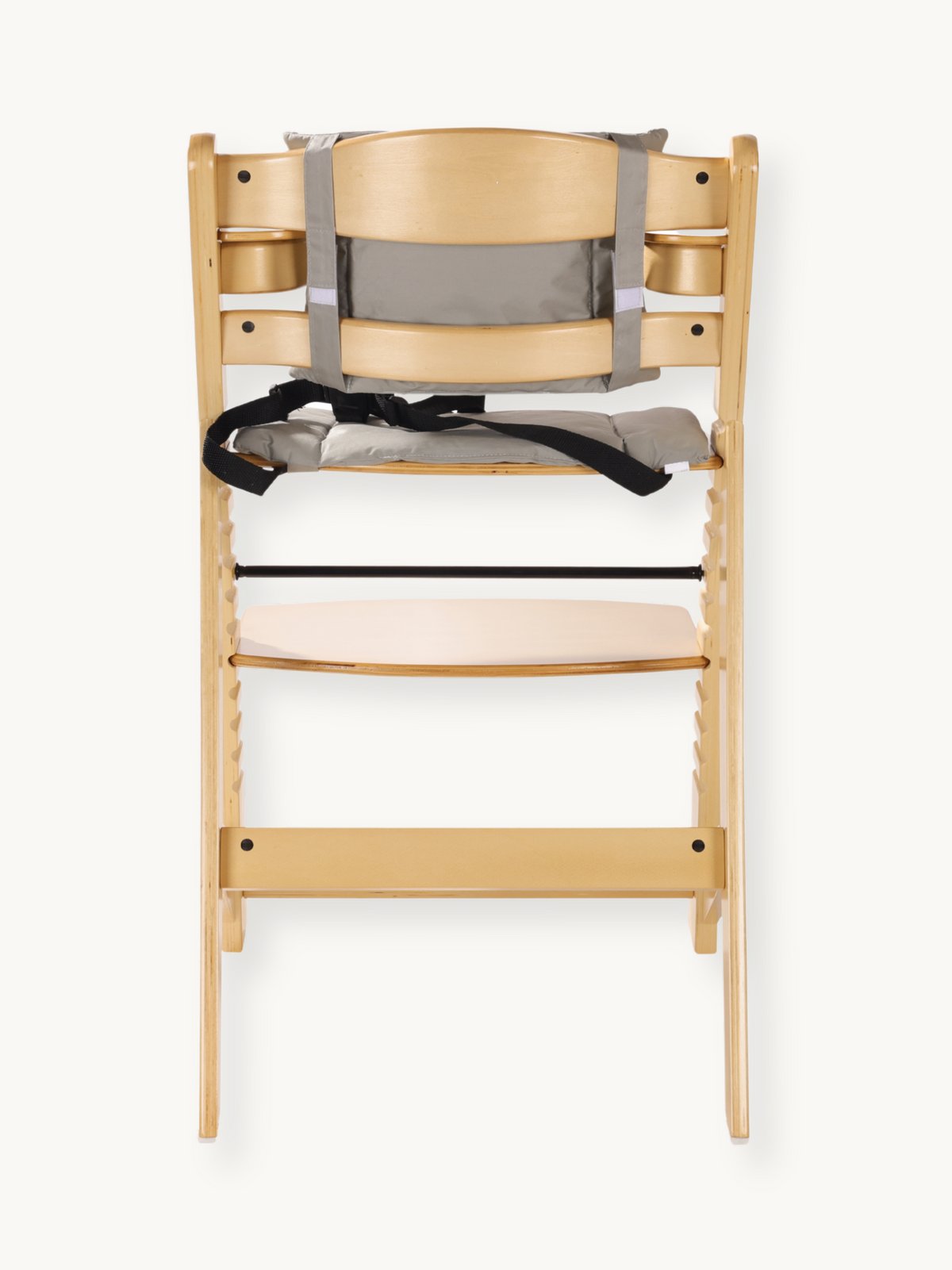 Natural wood highchair front view with grey padded cushion, black safety harness, and lower footrest shelf visible