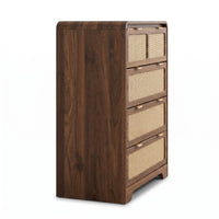 Angled side view of walnut tall chest showing rich wood grain on side panel and rattan-front drawers with gold handles