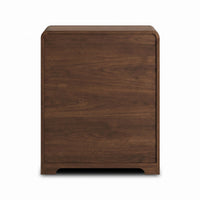 Walnut chest of drawers, rear side panel view showing wood grain texture and rounded corners, small cut-out feet visible