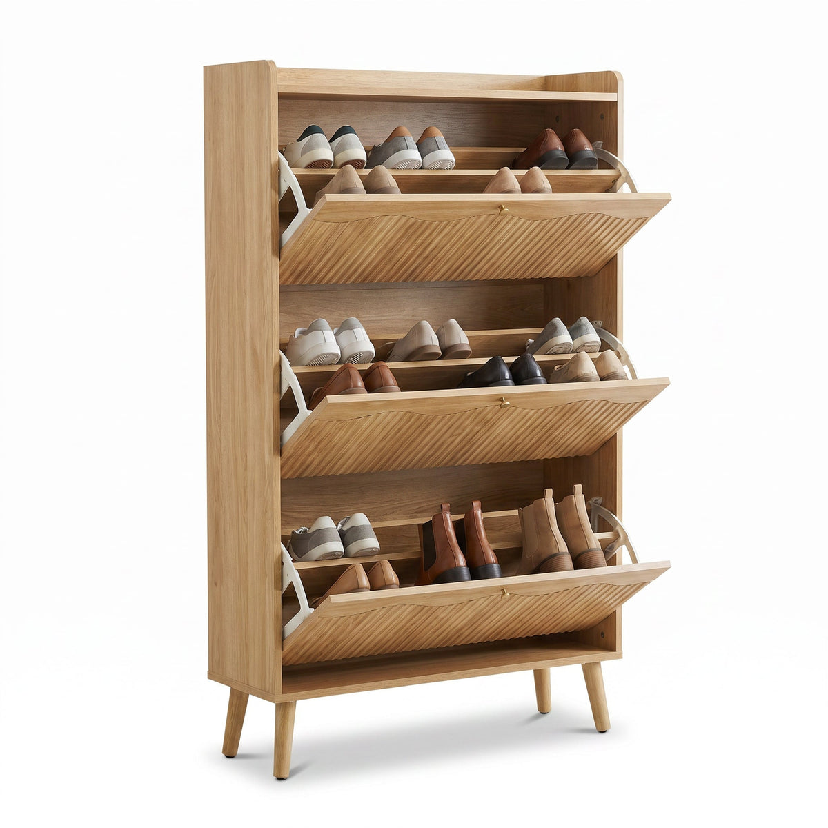 Natural oak three-tier flip-down shoe cabinet shown at an angle, all compartments open displaying assorted shoes and boots
