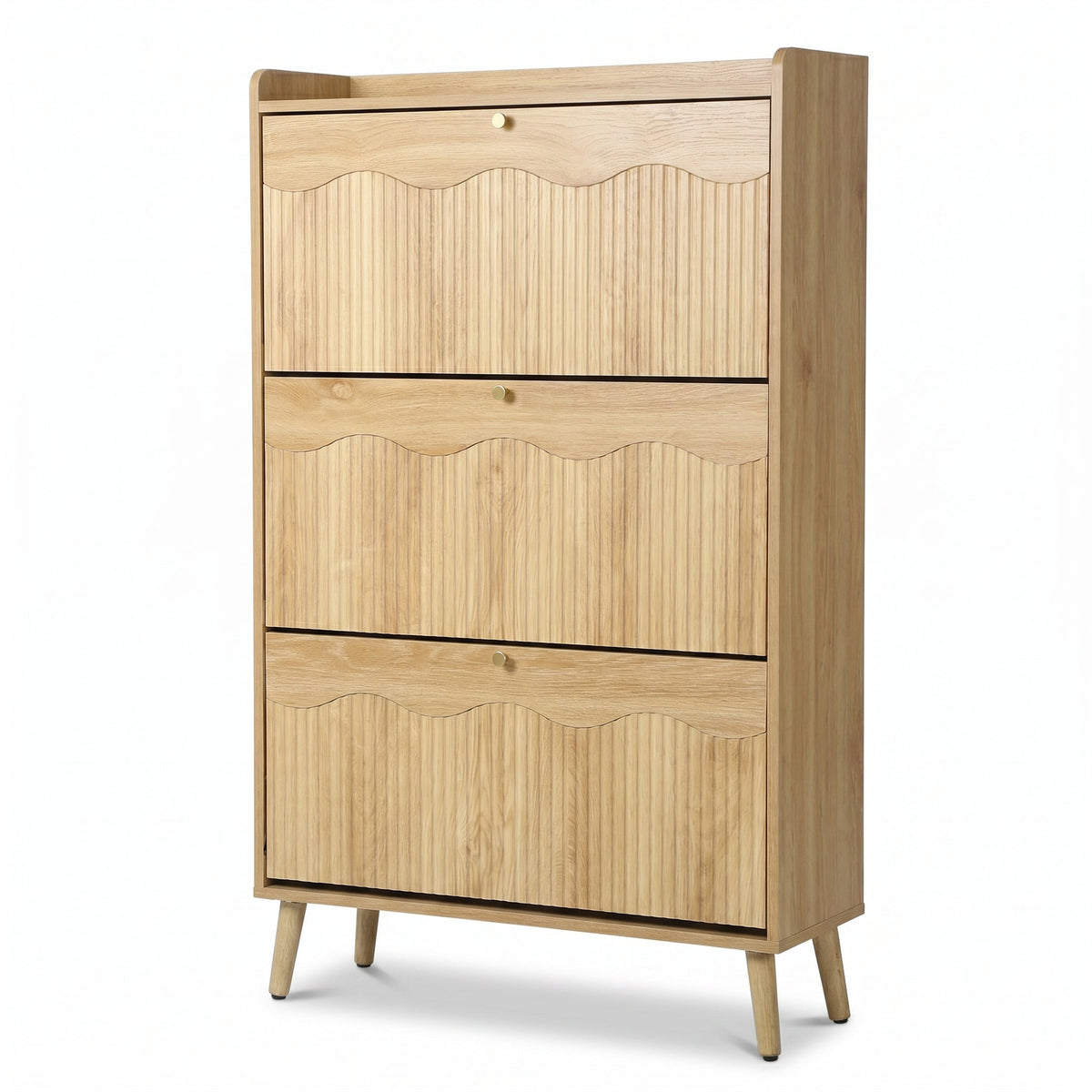 Light oak shoe cabinet with three flip-down ribbed doors, scallop-edge detail, brass knobs, and angled legs, angled front…
