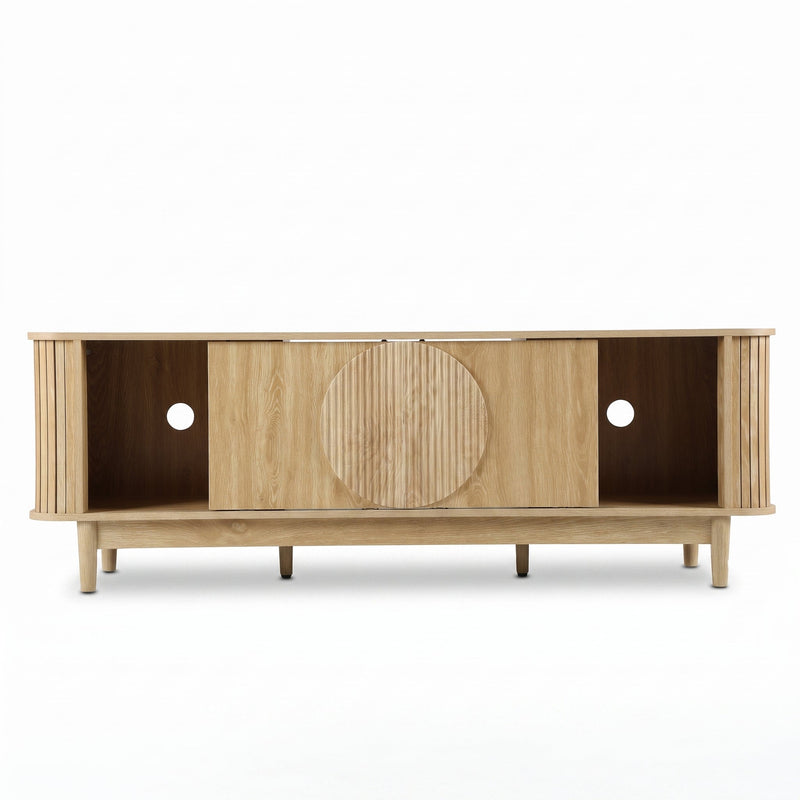 Light oak TV stand front view, sliding doors open revealing centre storage, circular ribbed door detail, cable holes visib…