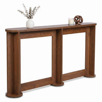 Walnut console table top styled with white ceramic vase, eucalyptus stems, glass candle, and woven wood ball ornament