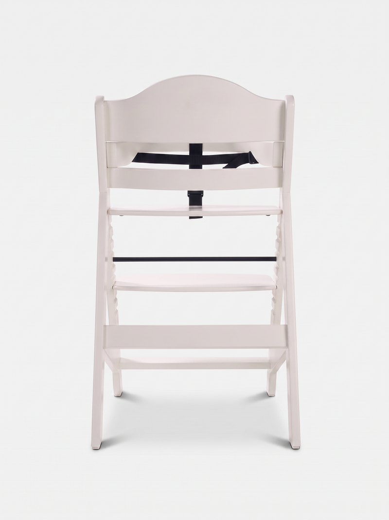 White wooden baby highchair rear view showing black safety harness straps and adjustable slatted seat and footrest positions