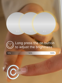 Finger pressing power button on round LED mirror, with overlay graphic showing brightness scale from 10% to 100%