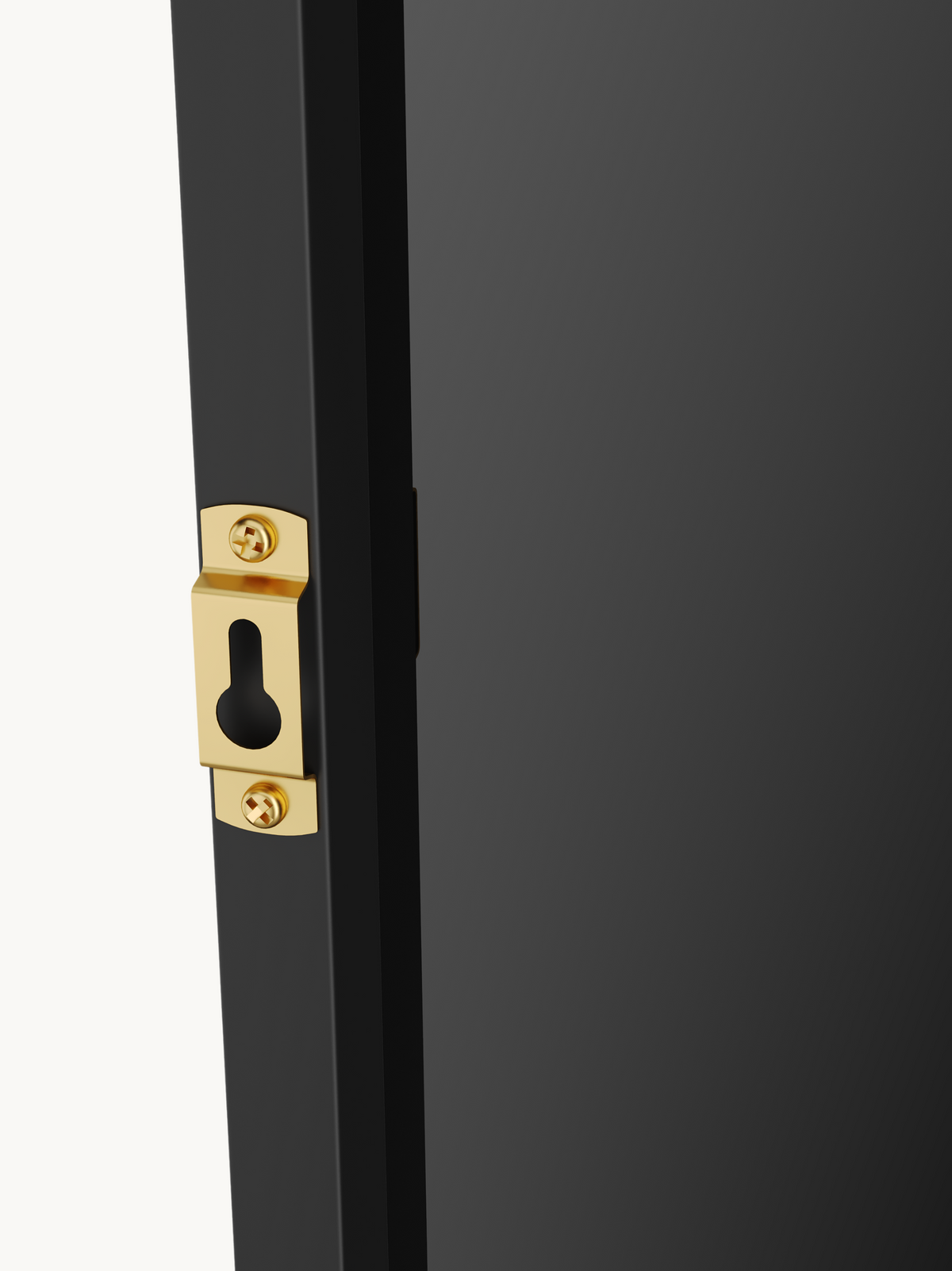 Close-up of gold-tone keyhole wall-mount bracket screwed into black aluminium mirror frame edge