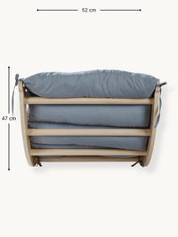 Front view of natural wood climbing arch with grey cushion, showing 52 cm width and 47 cm height dimension annotations