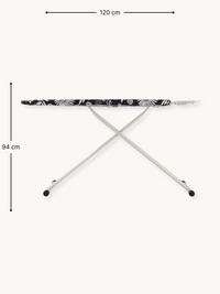 Ironing board front view with dimension annotations: 120 cm wide, 94 cm tall; black daisy-print cover on cream steel X-frame