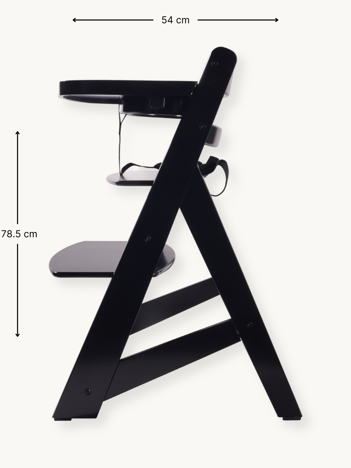 Black wooden highchair side view with dimension annotations: 54 cm wide, 78.5 cm tall; tray, footrest, and A-frame legs vi…