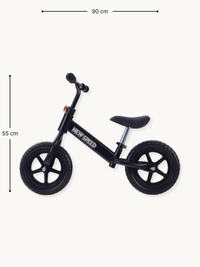 Black New Speed balance bike side view with 90 cm length and 55 cm height dimensions annotated, white logo on steel frame