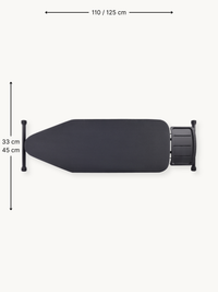 Top-down view of black ironing board with dark cotton cover and steam unit holder, annotated with 110/125 cm length and 33…