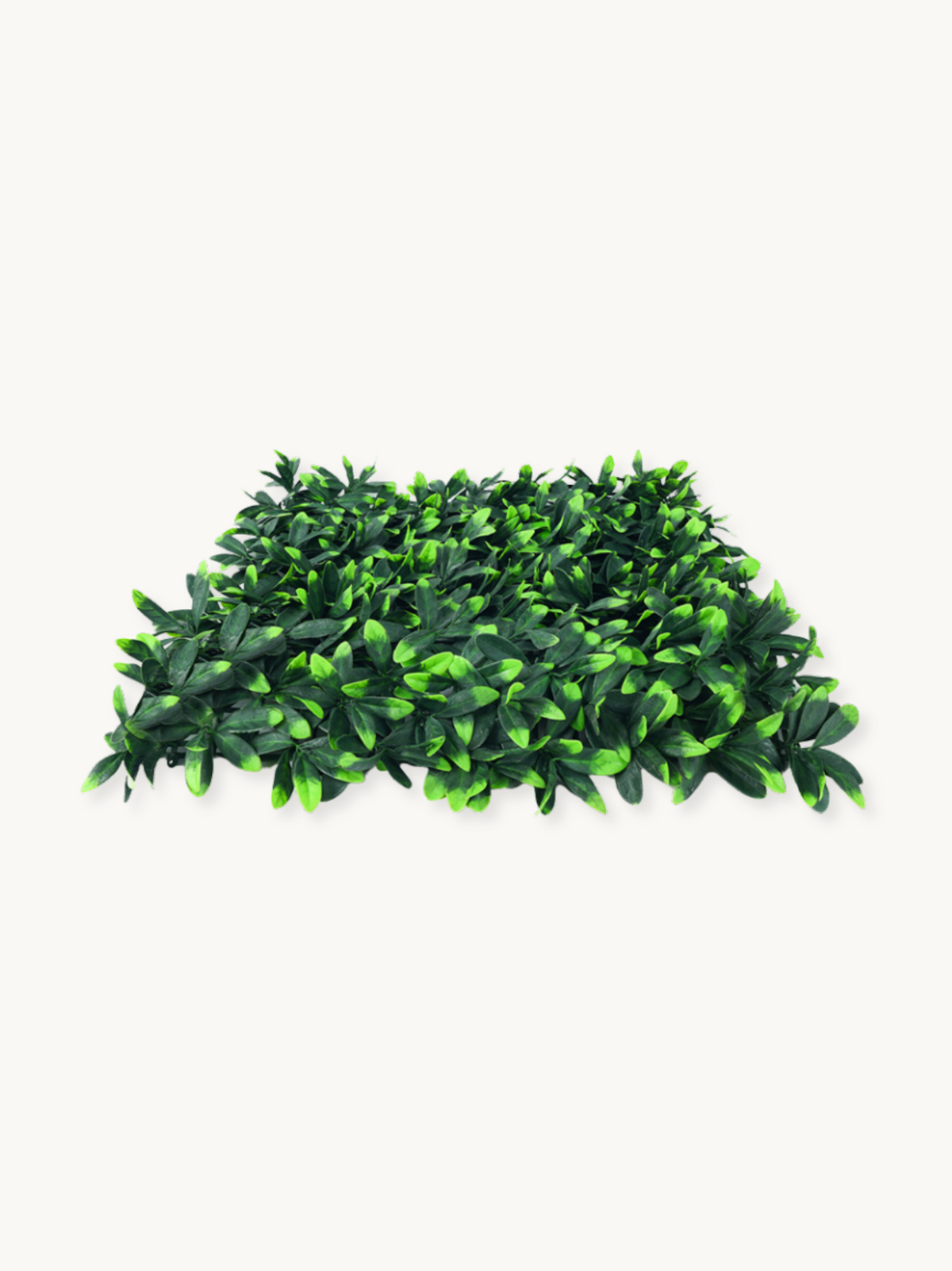 Single artificial green leaf panel laid flat, angled three-quarter view, showing dense dark and bright green plastic folia…
