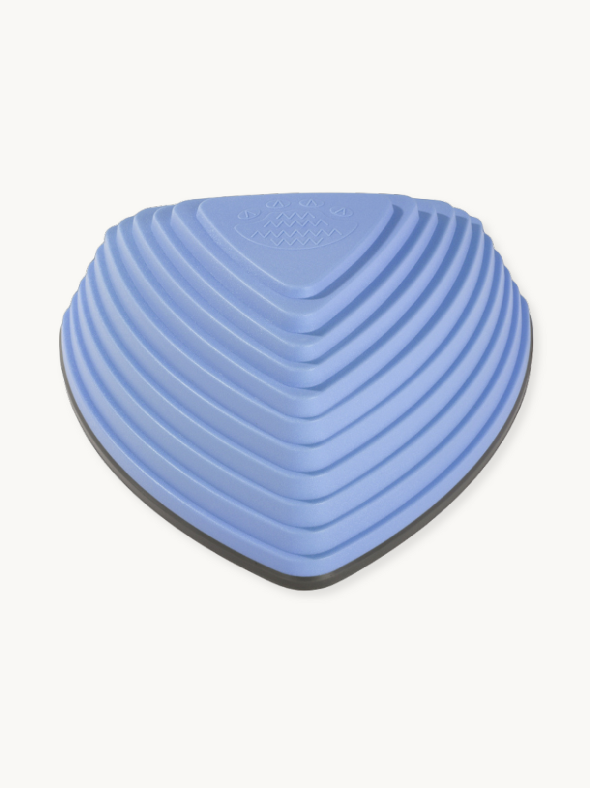 Periwinkle blue triangular balance stone, close-up top-down angle showing concentric ribbed texture and dark grey rubber b…