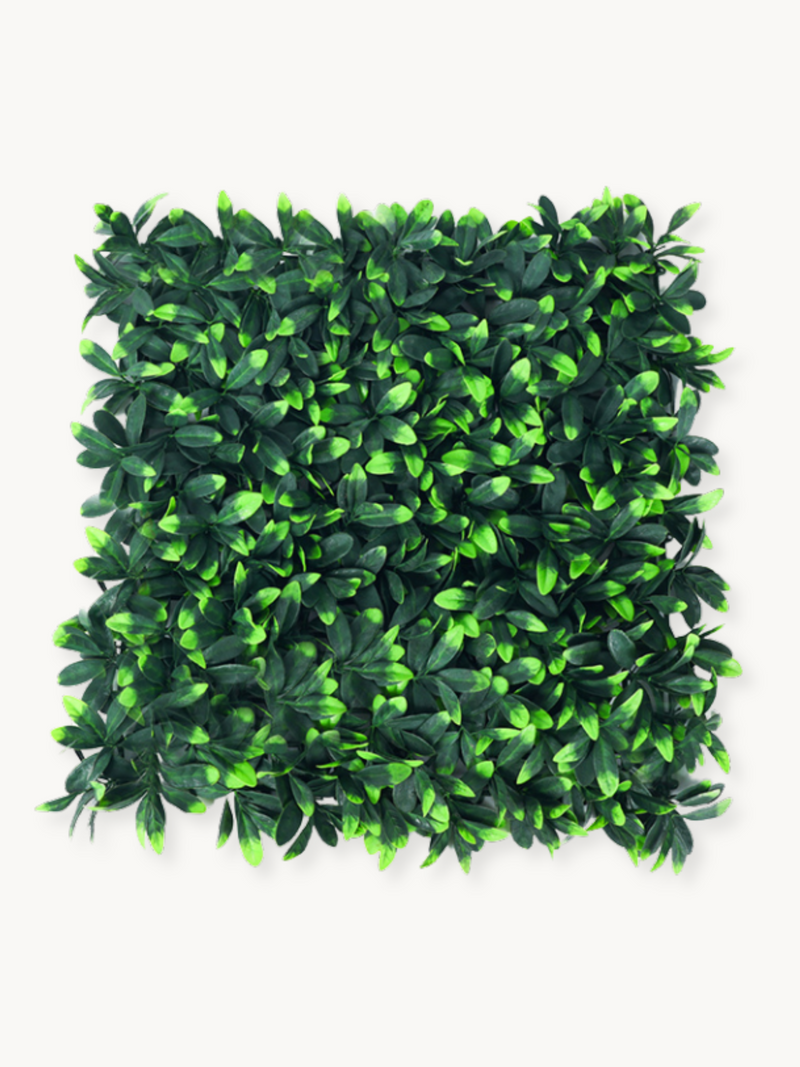 Square artificial green leaf wall panel with dense dark and bright green foliage, shot flat against white background