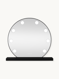 Round black-framed Hollywood vanity mirror with 10 lit bulbs around the edge, on a rectangular black base, front view