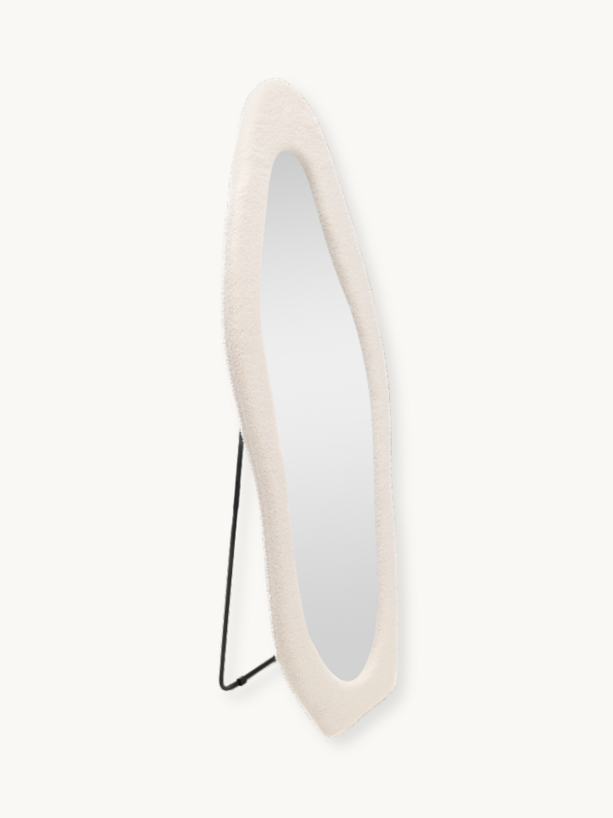 Angled side view of Seraphina floor mirror showing white teddy fabric frame depth and slim black metal easel stand