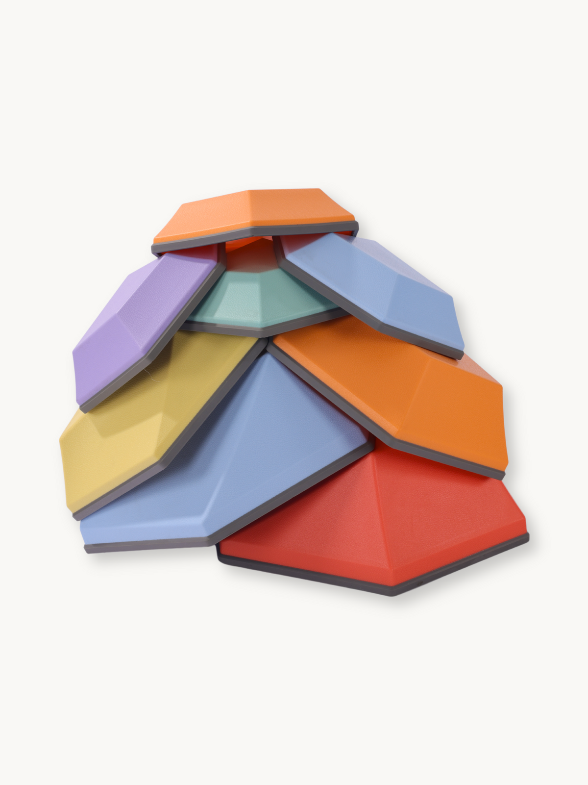 Eight multicolour hexagonal balance stones stacked in a dome formation, showing faceted tops in red, orange, blue, purple,…