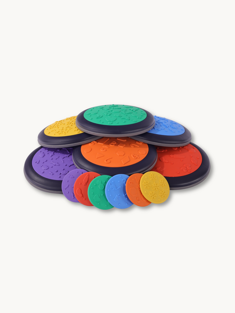 Six multicolor balance discs with embossed texture surfaces stacked in a fan arrangement, with six smaller flat discs disp…