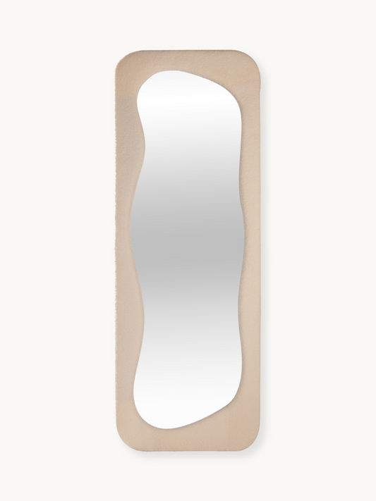 Asymmetrical standing mirror Felis with teddy fabric upholstery