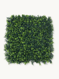 Square artificial green wall panel with dense dark and light green foliage, shot flat against a white background, one pane…