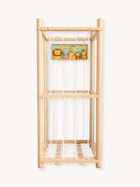 Natural pine wood cage-style stuffed animal organiser with white cord sides, two tiers, and an "Our Zoo" animal sign, fron…