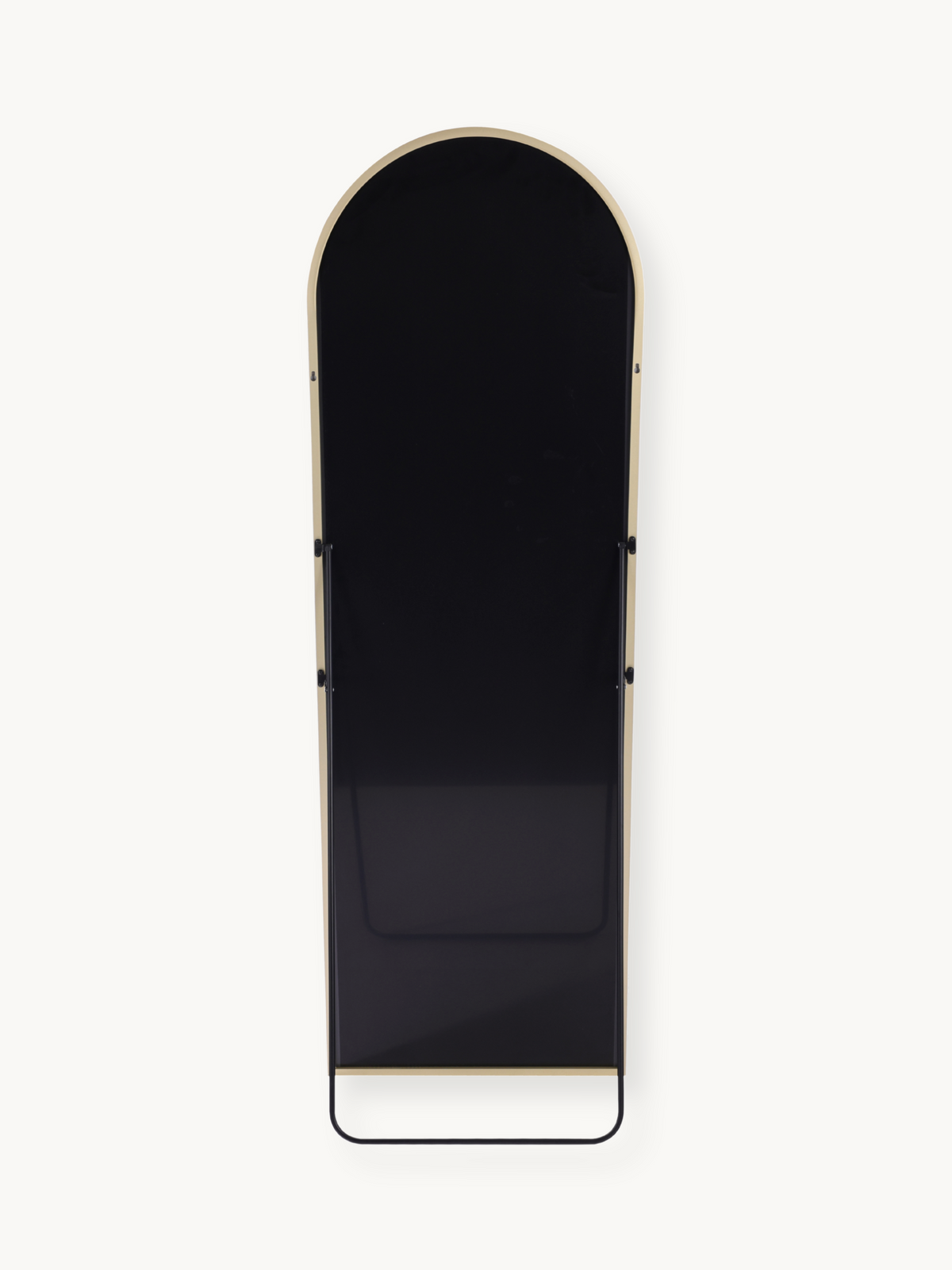 Rear view of tall arched standing mirror showing black panel back, gold aluminium frame edge, and black metal base bar